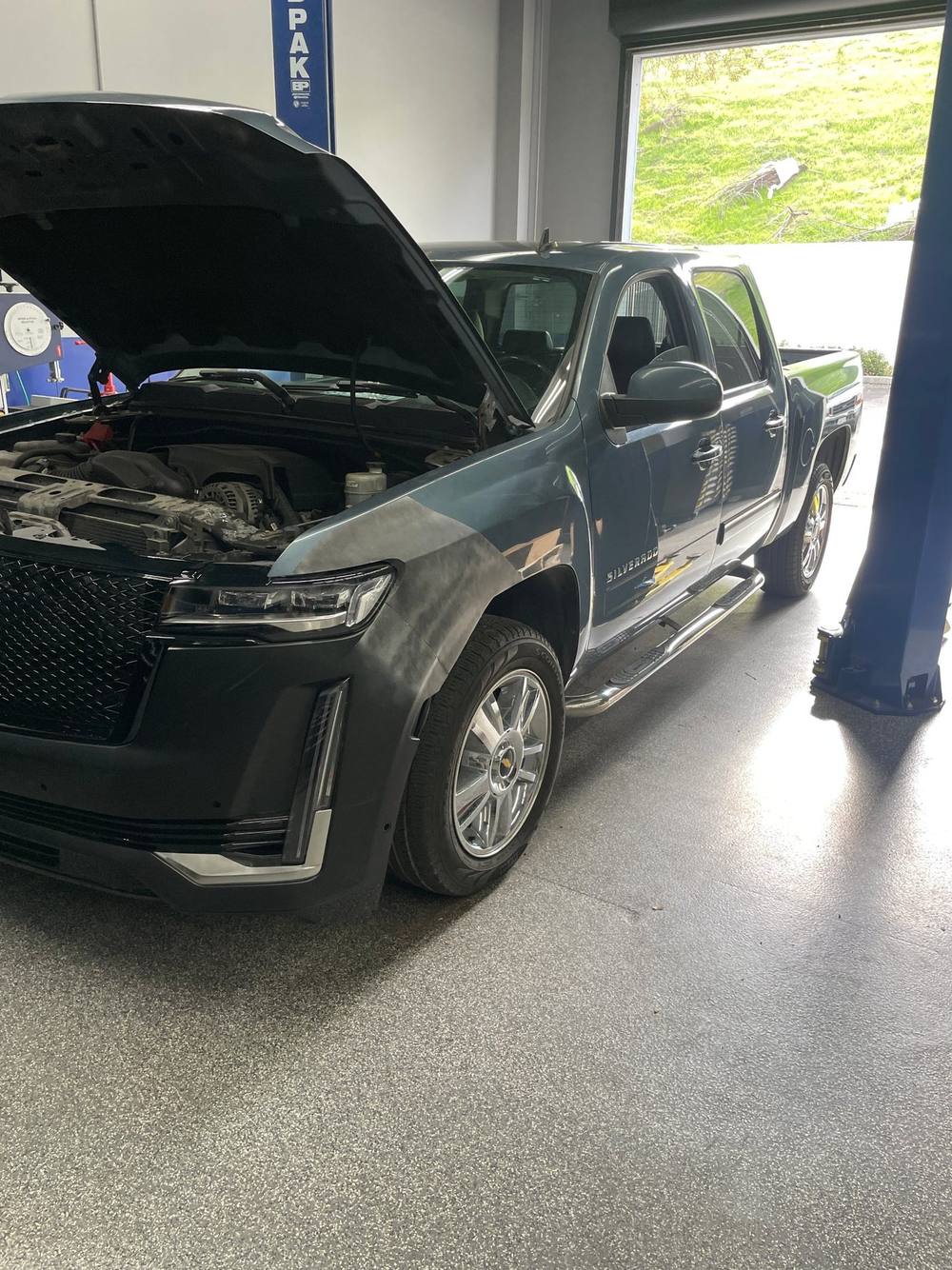 Silverado 1500 with Escalade-style front end test fitted in the shop
